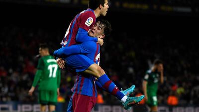 Riqui Puig celebrates with teammate Gavi after scoring for Barcelona against Osasuna. AFP
