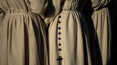 Penitents from 'Real Cofradia del Santisimo Cristo de las Injurias', also known as 'El Silencio' brotherhood gather prior a procession in Zamora, Spain. AP Photo