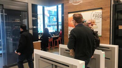 A customer walks out of the Amazon Go store, without needing to pay at a cash register, in Seattle, Washington. Jeffrey Dastin/Reuters