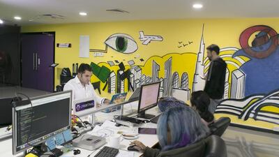 Dany El Eid, left, with his team, set up Pixelbug with Denis Kruger to make a children’s augmented reality app. Reem Mohammed / The National