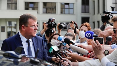 Andrei Ravkov, the head of State Secretary of the Security Council of Belarus, speaks reporters after the arrests. AP