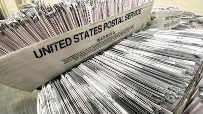 Empty ballots that were mailed by the deadline on election day are processed. Keith Birmingham/The Orange County Register via AP