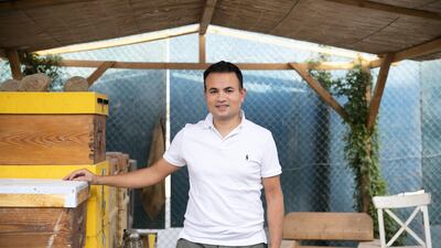 Jameel Khan and his family have a ready supply of honey after buying into the beehive farm at The Sustainable City in Dubai. Reem Mohammed/The National