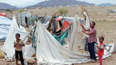 A Yemeni man rebuilds his tent after it was destroyed by torrential rain in a makeshift camp for the displaced in the northern Hajjah province. AFP