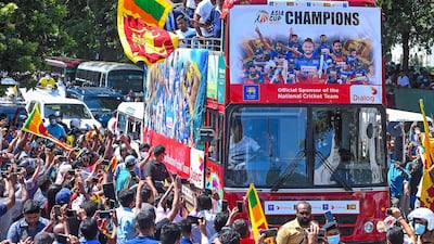 Sri Lankan players during their victory parade in Colombo. AFP