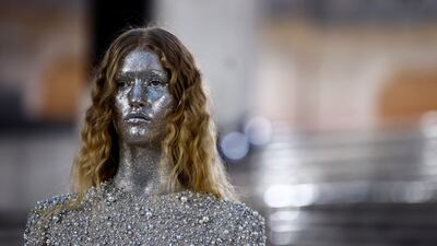 Elsewhere at Valentino, models had faces and necks completely covered in glitter. Reuters