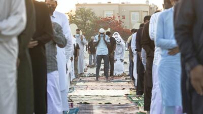 Shaking hands before and after prayer are prohibited, with people advised to greet each other from a distance. Antonie Robertson / The National