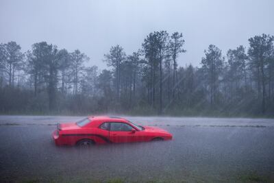 An abandoned car flooded by Hurricane Florence along Route 17 near Holly Ridge, North Carolina. Jim Lo Scalzo / EPA