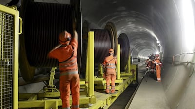 Construction workers working in the Gotthard Base Tunnel. The excavation work has taken more than 15 years and cost about US$12.7 billion. Karl Mathis / EPA