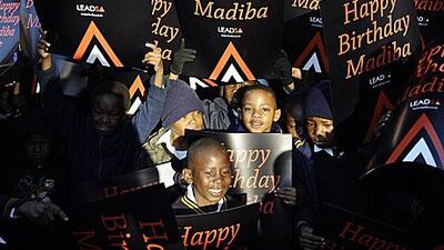 South African schoolchildren get ready to sing Happy Birthday to Nelson Mandela at a school in Soweto, Johannesburg.