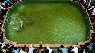 Nepalese Muslims wash themselves upon their arrival for the prayers during Ramadan in Kathmandu, Nepal. Navesh Chitrakar / Reuters