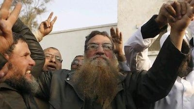 Abboud El Zomor, centre, is released from Tora Prison on March 12. He spent 30 years in jail for planning to overthrow the Anwar Sadat government.