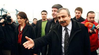 Pro-Kurdish politicians Sirri Sureyya Onder, right, Pelvin Buldan, left, and Altan Tan, centre, before meeting the imprisoned Kurdistan Workers' Party leader, Abdullah Ocalan. Reuters