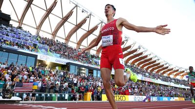 EUGENE, OREGON - JULY 18: Soufiane El Bakkali of Team Morocco celebrates as he crosses the finish line to win the gold medal in the Men's 3000m Steeplechase Final on day four of the World Athletics Championships Oregon22 at Hayward Field on July 18, 2022 in Eugene, Oregon. Ezra Shaw / Getty Images / AFP