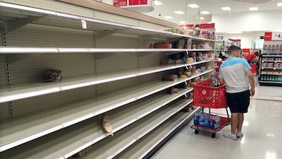 Shoppers encounter empty bread shelves at a store in Kissimmee. Reuters