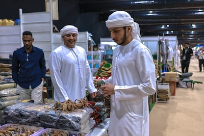 Nahyan Alkhyeli shops for a hood for his falcon at Adihex. Victor Besa / The National