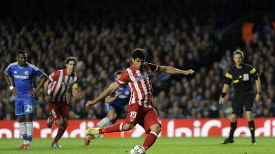 Atletico Madrid striker Diego Costa scores from a penalty during his side's Champions League victory over Chelsea on Wednesday. Gerry Penny / EPA / April 30, 2014