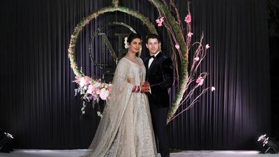 Newlyweds Priyanka Chopra, 36, and Nick Jonas, 26, pose for a photograph during a reception at a hotel in New Delhi on December 4, 2018. Photo: EPA