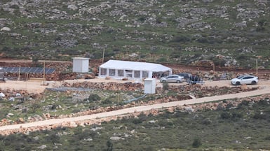 Israeli settlers inside a new settler outpost in the Wadi Al Lubban Al Shamali area, south of Nablus. EPA