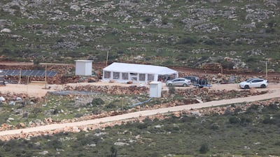 Israeli settlers inside a new settler outpost in the Wadi Al Lubban Al Shamali area, south of Nablus. EPA