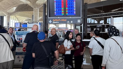 Passengers at Queen Alia International Airport in Amman on Friday. Jordanian airspace reopened on Saturday. Reuters