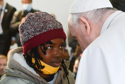 Pope Francis meets migrants on the Greek island of Lesbos. Reuters