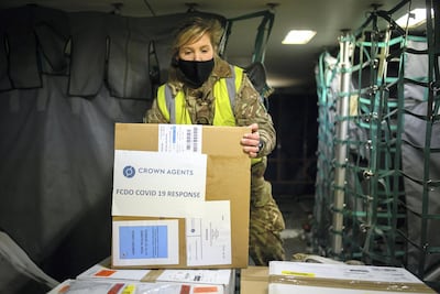 RAF personnel load a batch of the Covid-19 vaccine on to a Voyager aircraft bound for the Falkland Islands. Getty Images