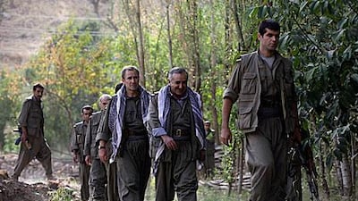 The Kurdistan Workers’ Party de-facto leader, Murat Karayilan, second from right, on the way to a press conference near the Iraqi-Turkish border, has praised the Turkish state’s overtures.
