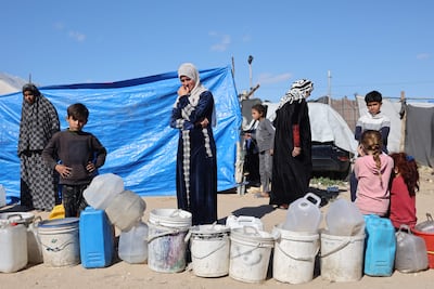 Palestinian women queue for drinking water in Gaza city. AFP