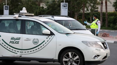 Dubai Police arrested a man for throwing a bottle out of his balcony that hit a pedestrian on his head. Pawan Singh/The National