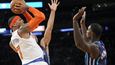 New York Knicks' Carmelo Anthony attempts a shot during a 96-93 NBA victory over the Charlotte Hornets on Sunday at Madison Square Garden in New York City. Bill Kostroun / AP / November 2, 2014