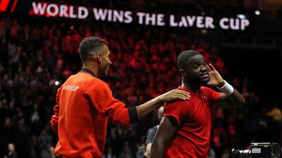 USA's Frances Tiafoe (R) and Canada's Felix Auger-Aliassime (L) of Team World celebrate on the court. AFP