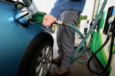 Men's spending on fuel was found to be one of the telling factors in the carbon footprint of males being bigger than that of females. AFP