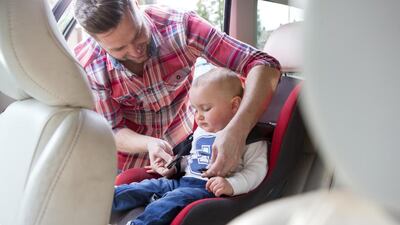 Readers say that children should be secure in moving cars. Getty Images