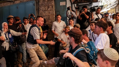 Israeli right-wing nationalists attack Palestinian journalist Saif Al Qawasmi in the Old City of Jerusalem during the Flag March. AFP