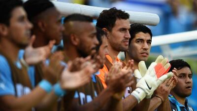 Luis Suarez of Uruguay shown before his side play Costa Rica on Saturday at the 2014 World Cup. The injured striker did not appear in the match. Laurence Griffiths / Getty Images