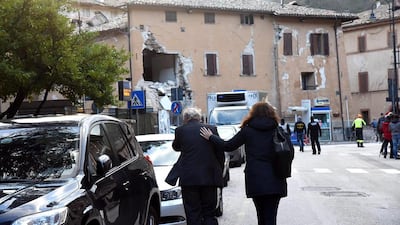 A view of damaged buildings as rescue teams operate at the first light of the day in the aftermath of two strong earthquakes hitting the region, in Visso. Matteo Crocchioni / EPA