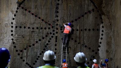 Technicians inspect an underground tunnel under construction of the Chennai Metro Rail. A UAE private group aims to invest $1bn in big-ticket Indian projects. Arun Sankar / AFP