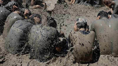 South Koreans get into the spirit of the annual Boryeong Mud Festival. Reuters