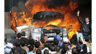 Sunni protesters burn a van belonging to Al Jazeera TV in Tripoli in northern Lebanon. A reader cautions against the notion that the proposed new prime minister Najib Miqati is Hizbollah's man. AP