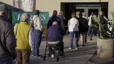 People wait in line to receive a Covid-19 vaccine in Tucson, Arizona. Bloomberg