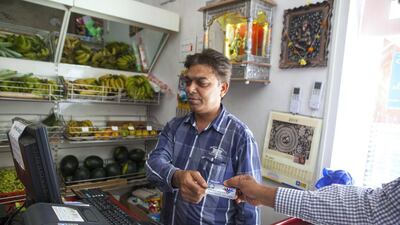 The trial of residents' smart cards for various transactions at Palava City is in progress. Subhash Sharma for The National