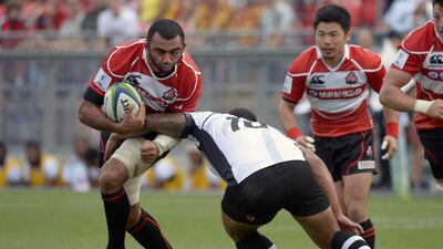 Japan's Michael Leitch, left, works his way around Fiji's Joshua Mataveis during the first half of a Pacific Nations Cup rugby match Wednesday, July 29, 2015, in Toronto. Jon Blacker/The Canadian Press