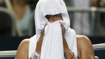 Germany's Anna-Lena Friedsam sits wrapped in a towel in her chair during her fourth round match against Poland's Agnieszka Radwanska at the Australian Open tennis tournament at Melbourne Park, Australia, January 24, 2016. Brandon Malone / Reuters