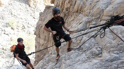 Instructors Chris Coyle, right, and David Sculthorpe demonstrate how to navigate the steep rock faces. Pawan Singh / The National