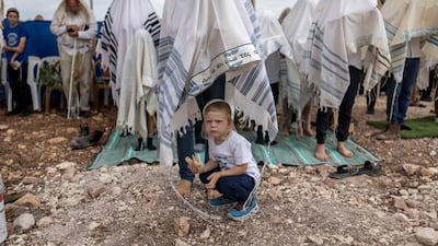 Israeli settlers offer Sukkot prayers in the occupied West Bank settlement of Noa. AFP