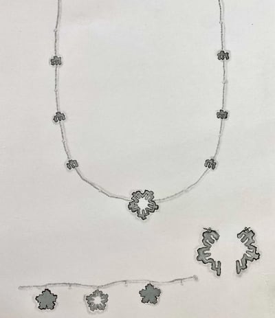 This winning design by Aysha Al Shlali, used topographical lines as charms on a necklace, bracelet and earrings. Courtesy Piaget