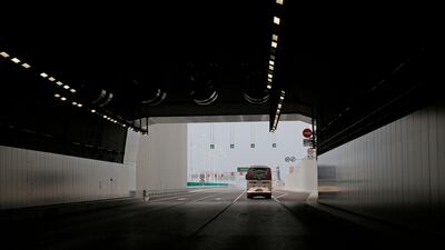 A vehicle drives through a tunnel. AP Photo