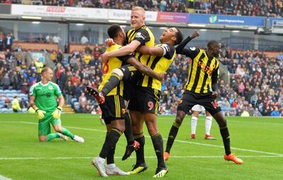 Will Hughes, centre, celebrates after scoring Watford's third goal against Burnley. AP Photo