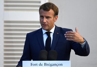 French President Emmanuel Macron speaks at the press conference after a meeting with German Chancellor Angela Merkel at Fort de Bregancon, in Bormes-les-Mimosas, France, on August 20, 2020 Reuters